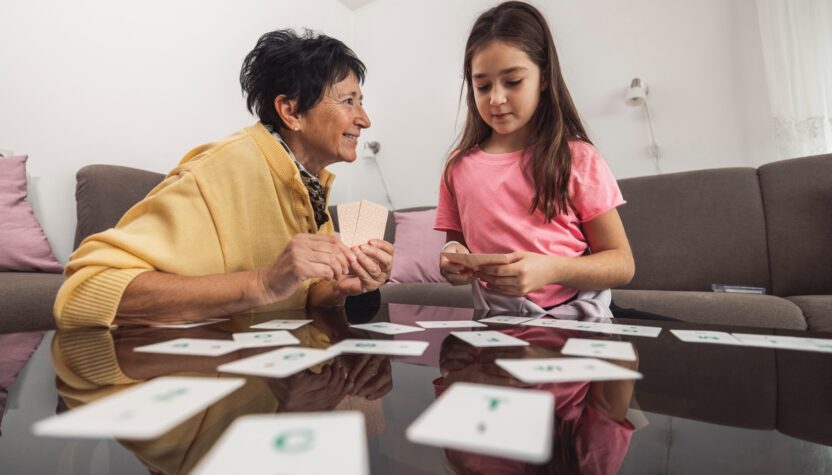 Grandmother and Granddaughter Playing Card Game