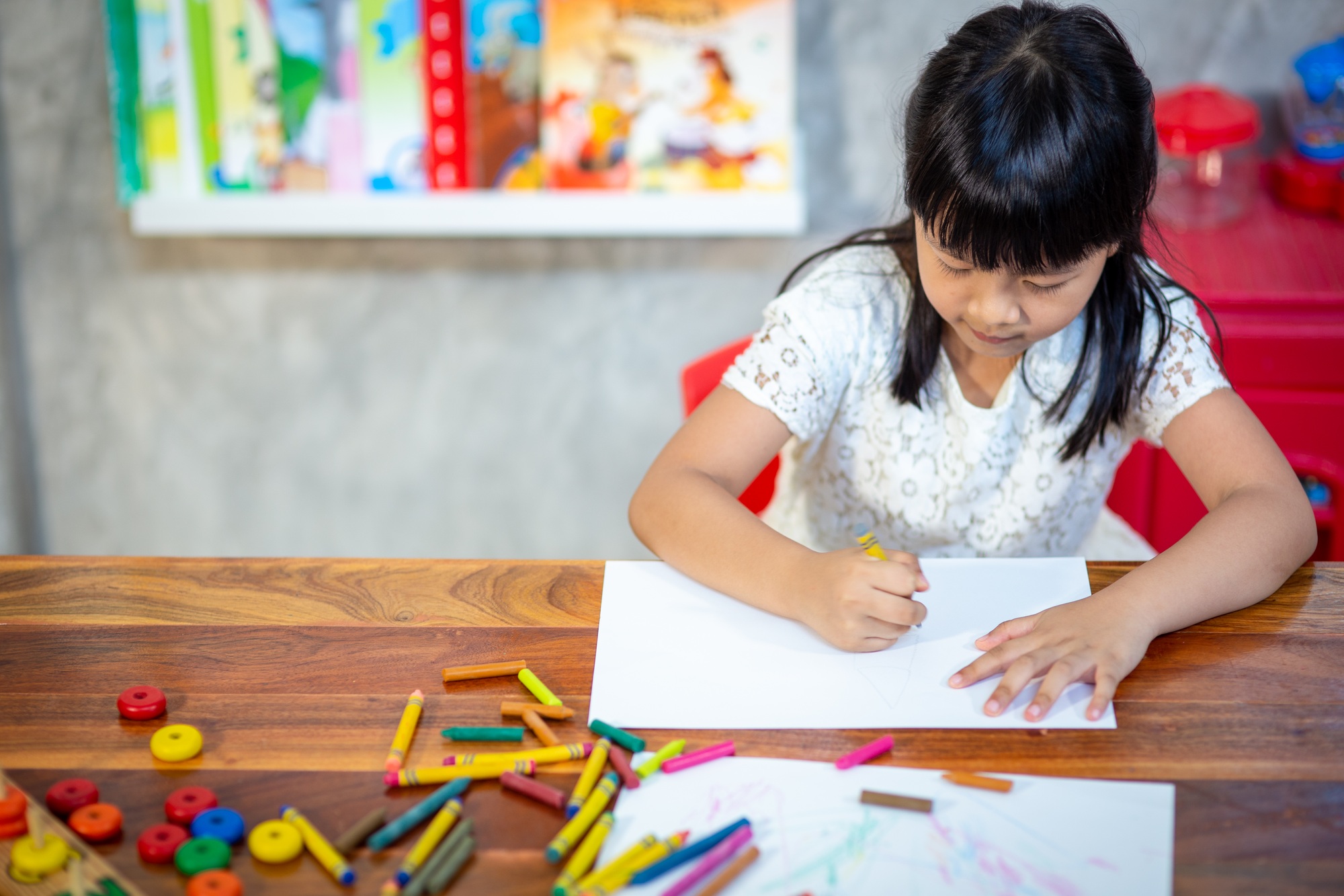 Preschooler child girl drawing and coloring
