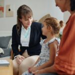 Social Worker Visiting To Family At Home