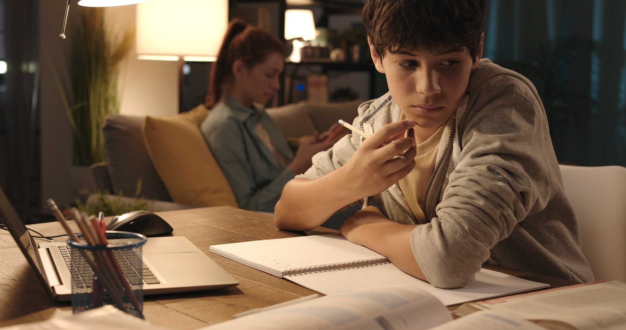 Student doing his homework at home