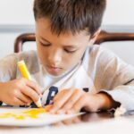 Child drawing on paper