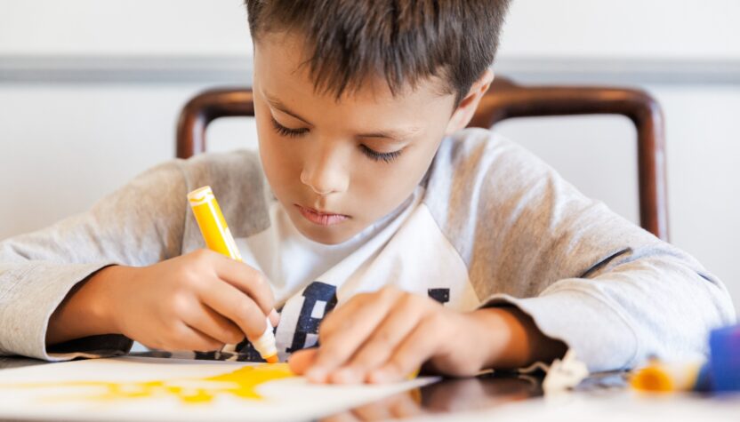 Child drawing on paper
