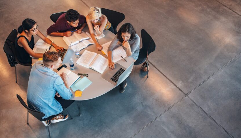 Group of students studying on laptop