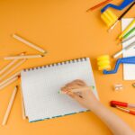 Little child hand drawing on the paper