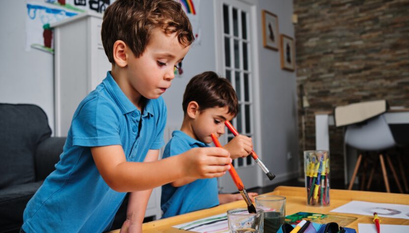 young boys playing with colors and drawing