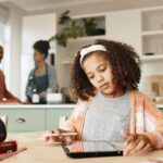 Girl child, house and drawing on tablet for homeschool, learning and growth or development of motor