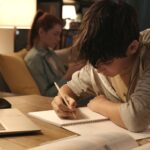 Student doing his homework at home